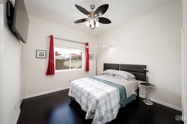 bedroom featuring dark wood-type flooring and ceiling fan