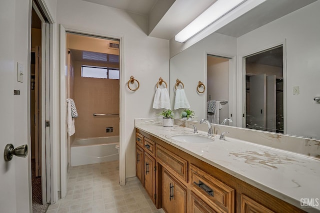 bathroom featuring bathing tub / shower combination and vanity