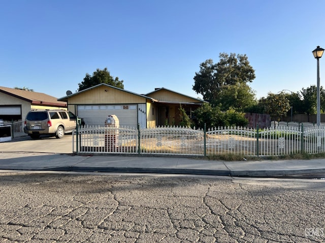 single story home featuring a garage