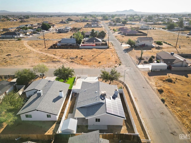 drone / aerial view featuring a residential view and a mountain view