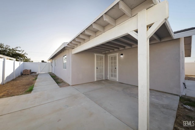 exterior space featuring fence and a gate