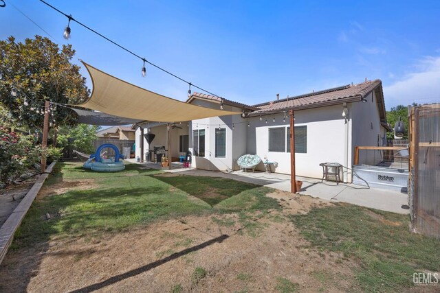 2004 Suncrisp Ln, Bakersfield, CA 93312 - rear view of house featuring a patio area and a tile roof