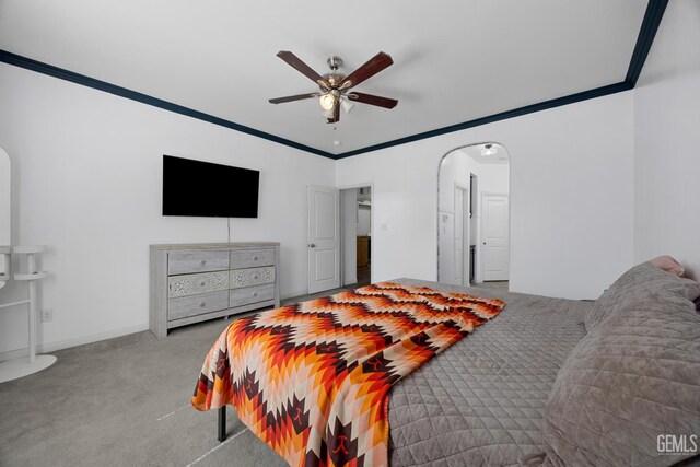 2004 Suncrisp Ln, Bakersfield, CA 93312 - carpeted bedroom featuring arched walkways, ornamental molding, and ceiling fan