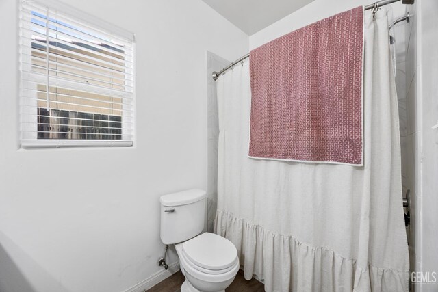 2004 Suncrisp Ln, Bakersfield, CA 93312 - full bathroom featuring toilet and a shower with shower curtain