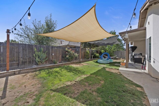 2004 Suncrisp Ln, Bakersfield, CA 93312 - fenced backyard with a patio area