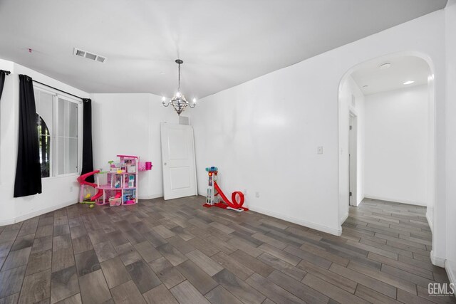 2004 Suncrisp Ln, Bakersfield, CA 93312 - game room featuring arched walkways, wood finished floors, and a chandelier