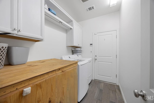 2004 Suncrisp Ln, Bakersfield, CA 93312 - laundry area featuring separate washer and dryer, cabinet space, and dark wood-type flooring