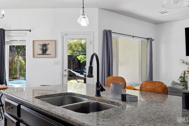 2004 Suncrisp Ln, Bakersfield, CA 93312 - kitchen with decorative light fixtures and light stone countertops