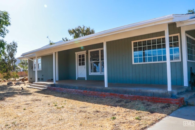 entrance to property with a porch