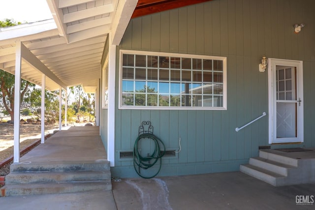 property entrance featuring covered porch