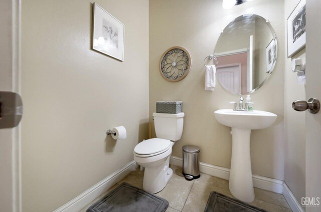 9109 Red Pine Dr, Shafter, CA 93263 - half bath with tile patterned floors, baseboards, and toilet