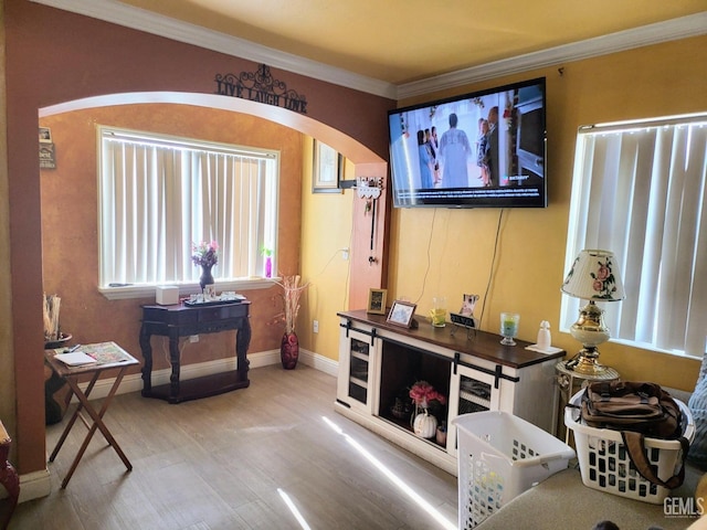 foyer featuring crown molding and hardwood / wood-style floors