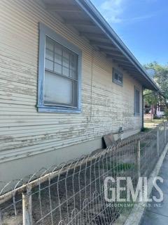 view of property exterior with fence