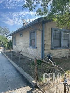 view of side of property with fence