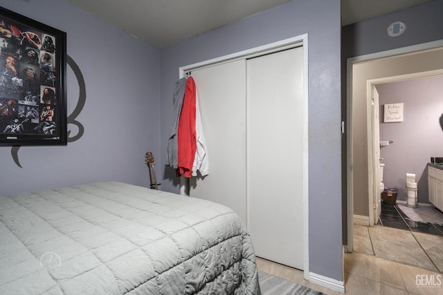 tiled bedroom with a closet