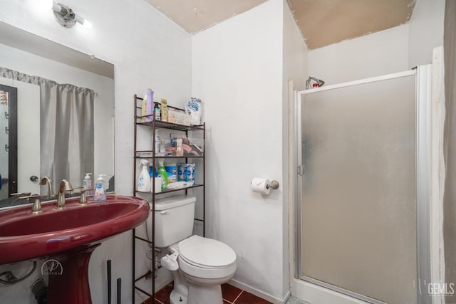 full bathroom featuring a shower stall and toilet