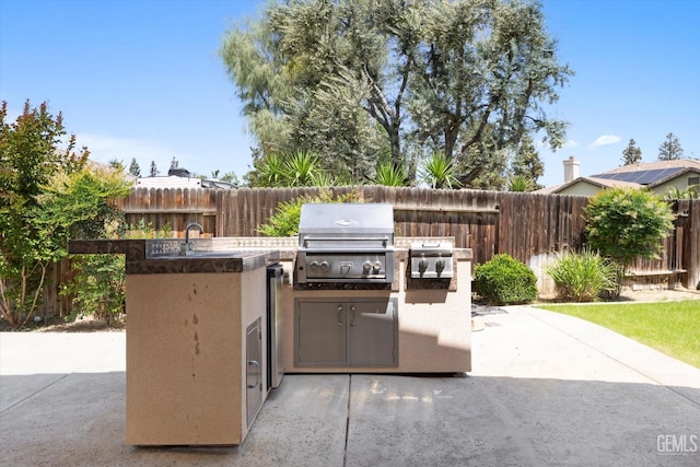 9508 Canyon Lake Ct, Bakersfield, CA 93312 - view of patio featuring area for grilling, a fenced backyard, and a sink