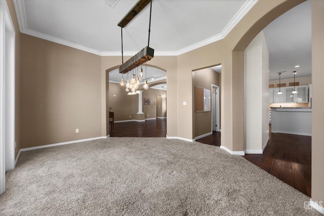 9508 Canyon Lake Ct, Bakersfield, CA 93312 - unfurnished dining area featuring dark carpet, arched walkways, baseboards, and crown molding