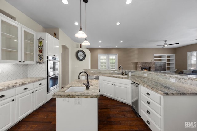 9508 Canyon Lake Ct, Bakersfield, CA 93312 - kitchen with a sink, appliances with stainless steel finishes, a center island with sink, and ceiling fan