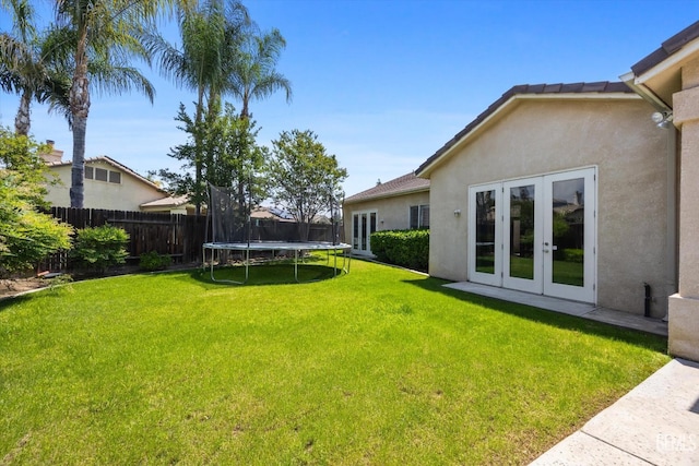 9508 Canyon Lake Ct, Bakersfield, CA 93312 - view of yard with fence, french doors, and a trampoline