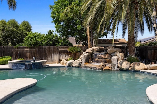 9508 Canyon Lake Ct, Bakersfield, CA 93312 - view of swimming pool with a pool with connected hot tub and a fenced backyard