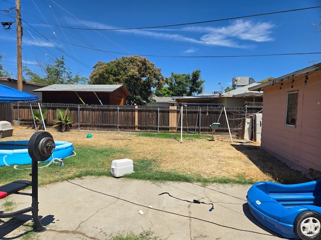 1704 Bower St, Bakersfield, CA 93305 - fenced backyard featuring a patio area