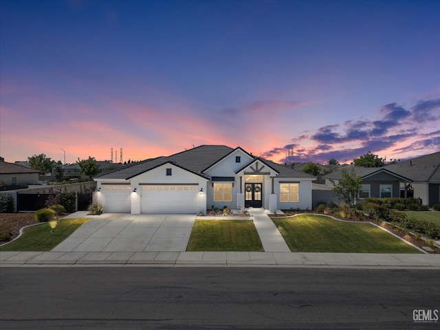 16711 Keystone Pl, Bakersfield, CA 93314 - modern farmhouse style home with a lawn, a garage, french doors, driveway, and a tiled roof