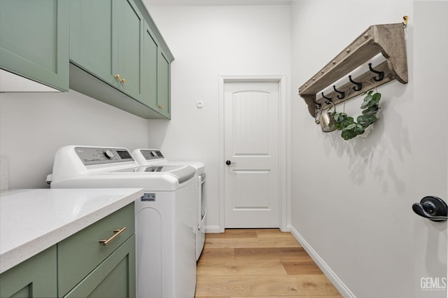 16711 Keystone Pl, Bakersfield, CA 93314 - laundry area featuring cabinet space, light wood-type flooring, and washer and clothes dryer