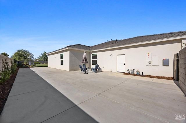 16711 Keystone Pl, Bakersfield, CA 93314 - rear view of house with stucco siding and a patio