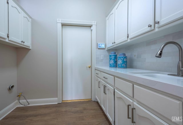 1715 Norwich Way, Bakersfield, CA 93311 - washroom featuring cabinet space and dark wood-style flooring