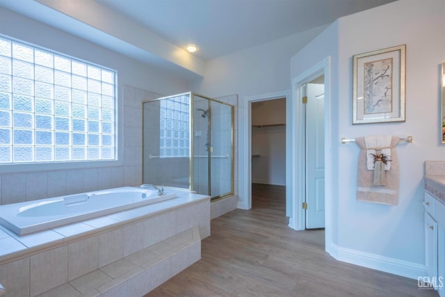 1715 Norwich Way, Bakersfield, CA 93311 - full bath with vanity, a stall shower, a bath, wood finished floors, and a walk in closet