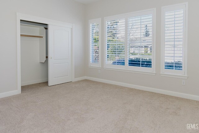 1715 Norwich Way, Bakersfield, CA 93311 - unfurnished bedroom featuring carpet floors, multiple windows, and a closet