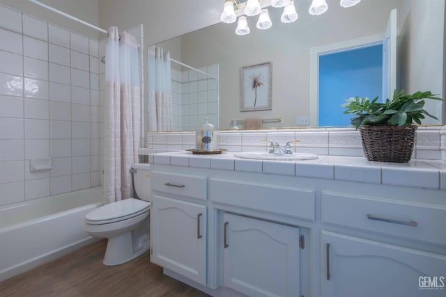 1715 Norwich Way, Bakersfield, CA 93311 - bathroom featuring vanity, shower / bath combo with shower curtain, wood finished floors, and a chandelier