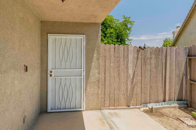 4810 Bluestone Dr, Bakersfield, CA 93311 - doorway to property featuring stucco siding