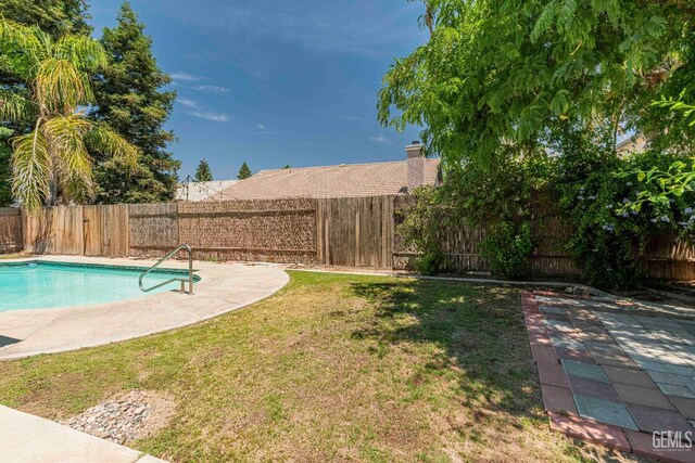4810 Bluestone Dr, Bakersfield, CA 93311 - view of swimming pool with a fenced backyard and a patio