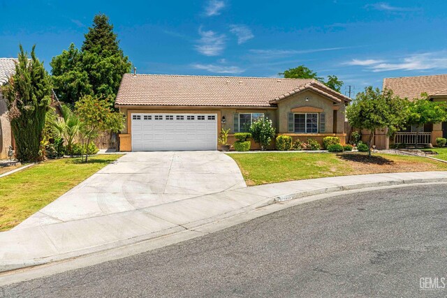 4810 Bluestone Dr, Bakersfield, CA 93311 - view of front of house featuring a tile roof, stucco siding, driveway, and a garage