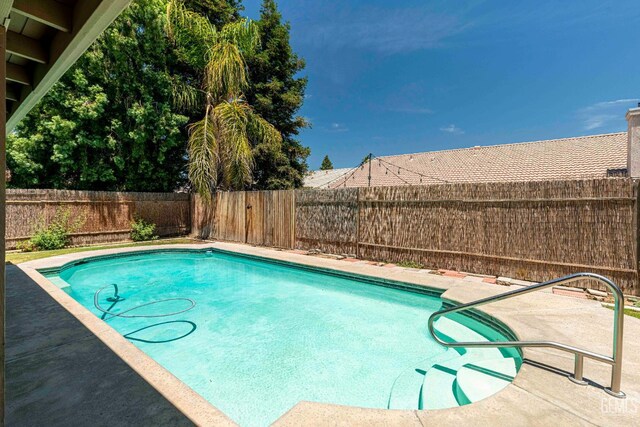 4810 Bluestone Dr, Bakersfield, CA 93311 - view of swimming pool with a fenced backyard