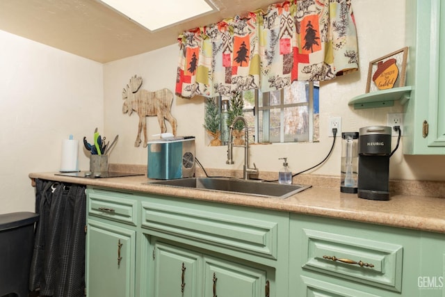 kitchen with green cabinets and sink