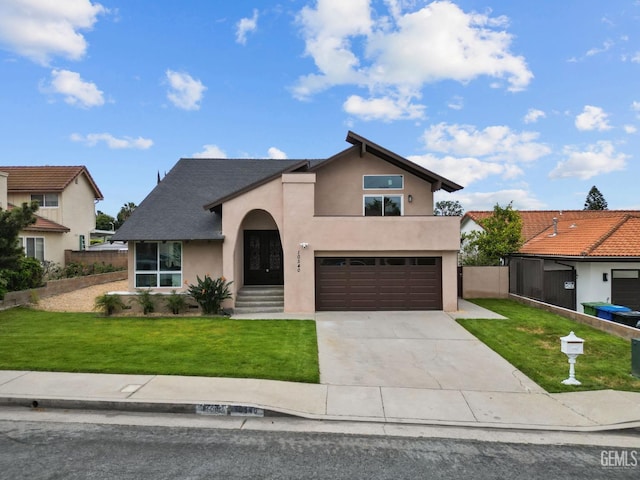 view of front of house featuring stucco siding, concrete driveway, a front yard, and a garage