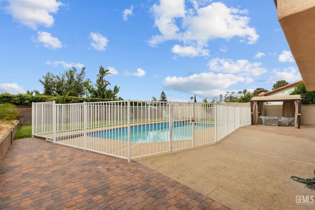 view of pool featuring a fenced in pool, fence, a gazebo, and a patio area