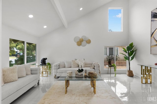 living area featuring beam ceiling, high vaulted ceiling, and plenty of natural light