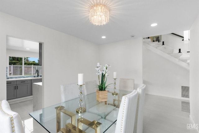 dining room featuring a chandelier, visible vents, stairway, and recessed lighting