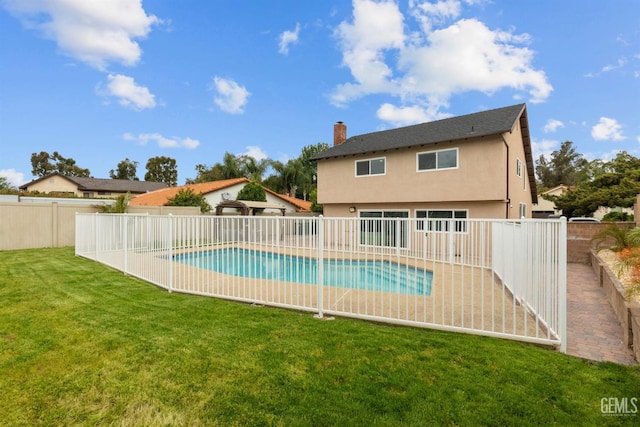 view of swimming pool featuring a fenced in pool, a yard, and a fenced backyard