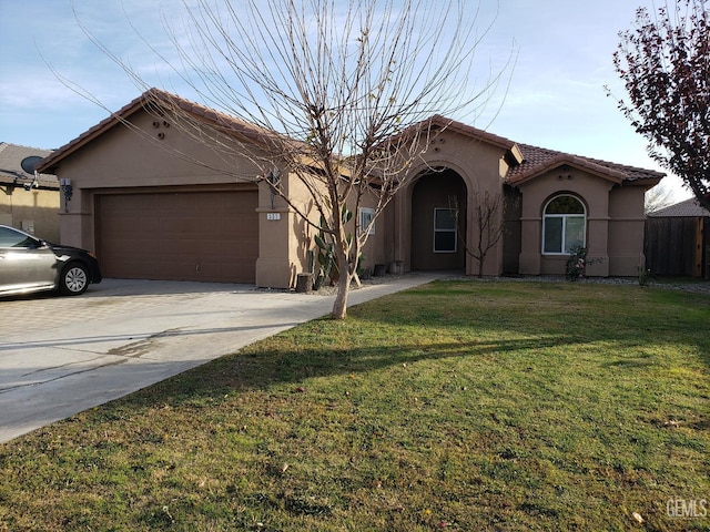 view of front of property with a garage and a front yard