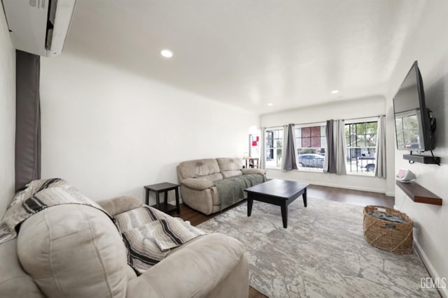 living area featuring recessed lighting, wood finished floors, and baseboards