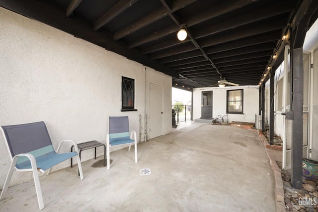 view of patio featuring ceiling fan