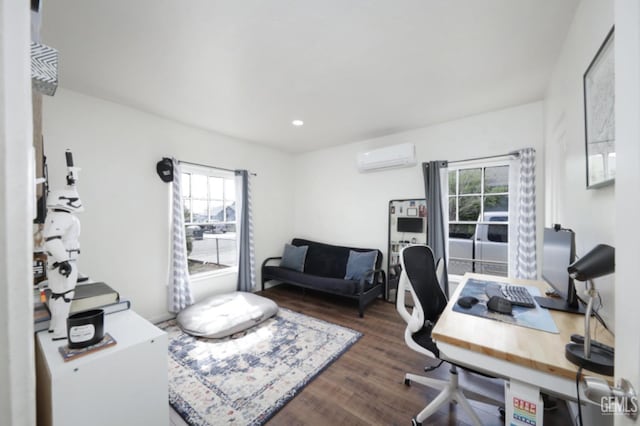 home office featuring an AC wall unit, recessed lighting, and wood finished floors