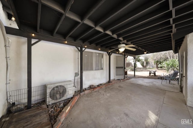 view of patio / terrace featuring a ceiling fan and ac unit