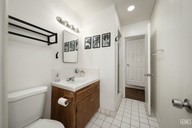 full bathroom with tile patterned floors, an enclosed shower, toilet, recessed lighting, and vanity