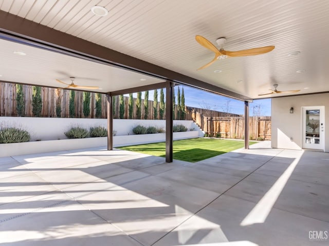 view of patio with a fenced backyard and ceiling fan